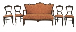 Sofa a čtyři židle, 1860-1880. Sofa - čalouněný sedák, opěrák a loketní opěrky, řezané reliéfně zdobené, prohnuté tvarované nohy. Židle - čalouněný sedák reliéfně zdobený