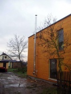 Komín je nakonec kvůli sousedce mnohem vyšší, než bylo původně v plánu