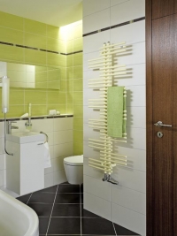 Koupelnový radiátor Zehnder Yucca svým vzhledem připomíná palmu juka, 1 340 x 500 mm, připojení na elektrický provoz, provedení jednořadové, barva pergamon, cena (bez DPH) 34 453 Kč